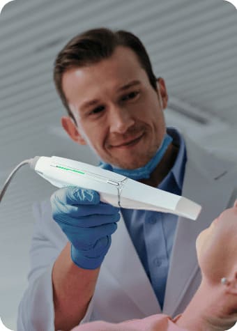 dentist using modern dental device on patient