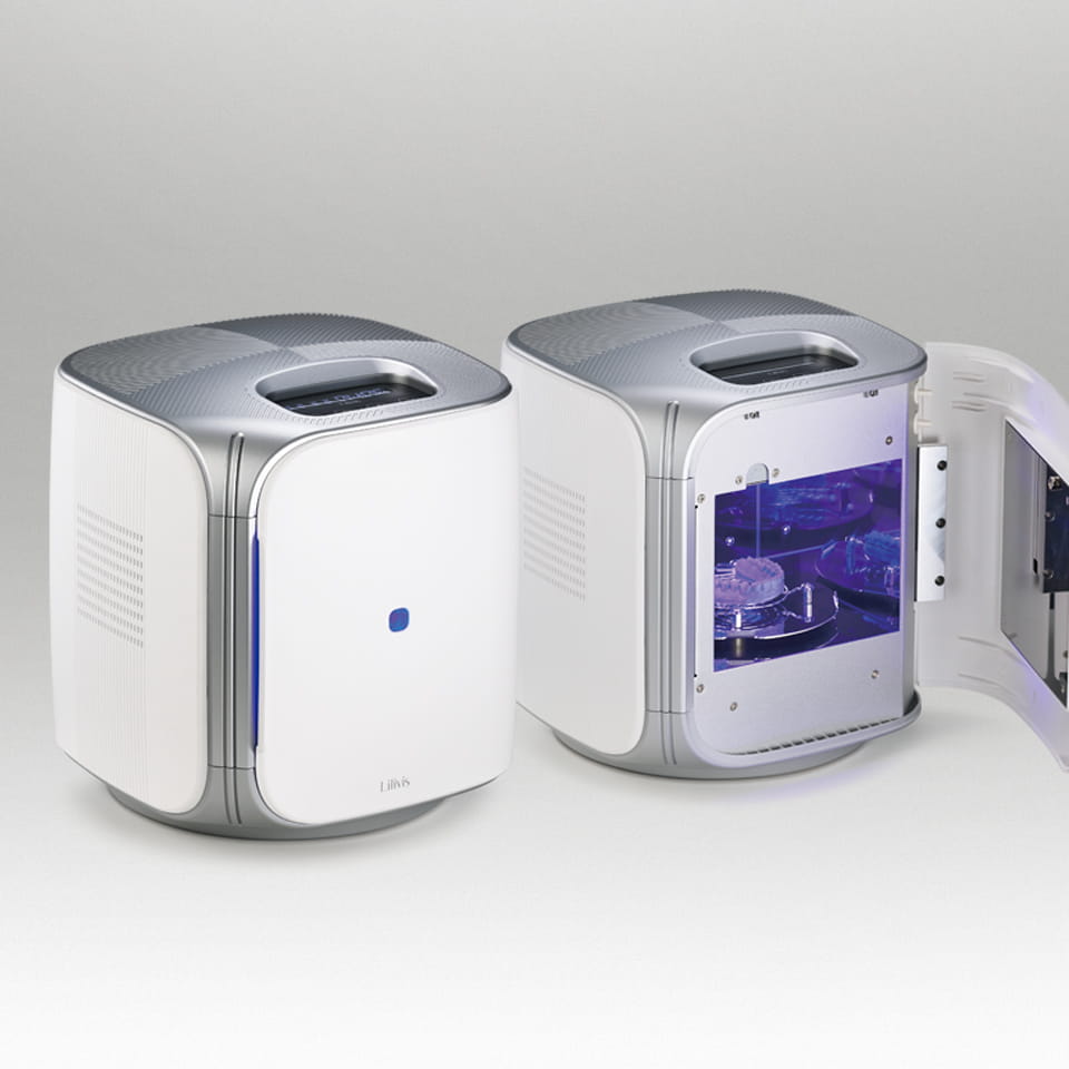 Lilivis CURE dental UV curing machines showing a closed unit with blue light and an open unit displaying inner trays.